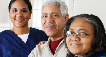 two elderly with their caretaker